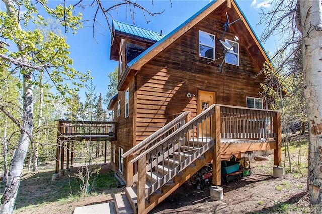 362 Kite Ct, Jefferson, CO 80456 - rear view of property featuring stairway, a deck, and a metal roof