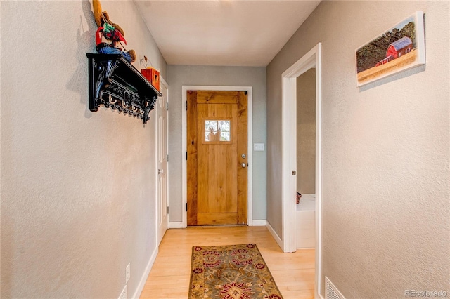 362 Kite Ct, Jefferson, CO 80456 - doorway to outside featuring light wood-style flooring and baseboards