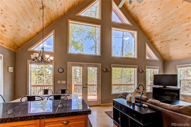 362 Kite Ct, Jefferson, CO 80456 - living area featuring wooden ceiling, french doors, high vaulted ceiling, a chandelier, and light wood-style floors