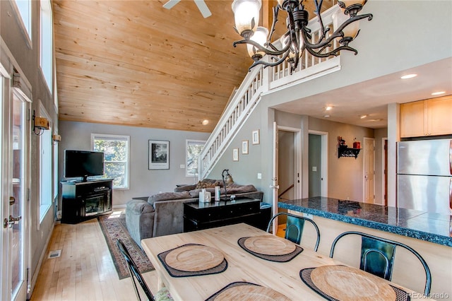 362 Kite Ct, Jefferson, CO 80456 - dining room featuring light wood-style flooring, recessed lighting, stairs, a chandelier, and wooden ceiling
