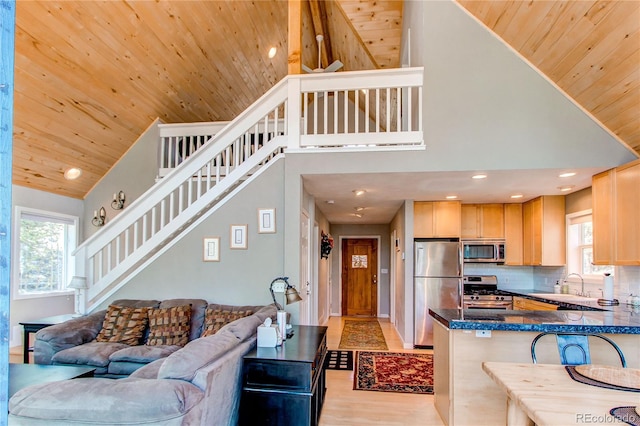 362 Kite Ct, Jefferson, CO 80456 - kitchen featuring stainless steel appliances, high vaulted ceiling, wooden ceiling, light brown cabinets, and a peninsula