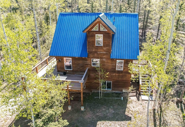 362 Kite Ct, Jefferson, CO 80456 - back of house with a wooden deck, a metal roof, and stairway