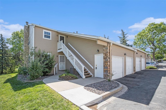 360 S Estes St Unit C, Lakewood, CO 80228 - view of property featuring central AC unit