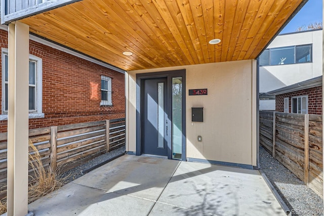 doorway to property with stucco siding