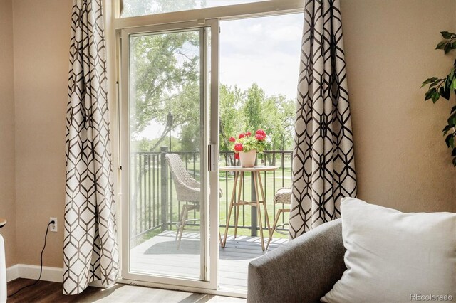 2945 W Riverwalk Cir Unit B, Littleton, CO 80123 - doorway to outside with wood finished floors and baseboards
