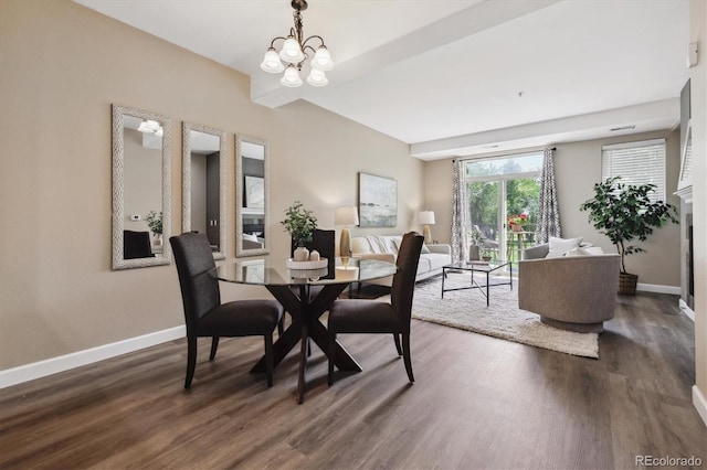 2945 W Riverwalk Cir Unit B, Littleton, CO 80123 - dining space with dark wood-type flooring, baseboards, and a chandelier