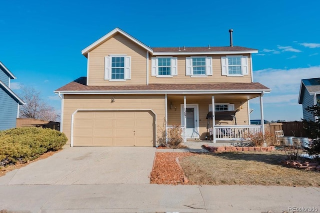 view of front of house with covered porch, driveway, and a garage