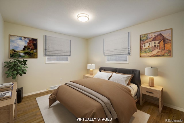 740 Lotus Way, Broomfield, CO 80020 - bedroom featuring wood finished floors and baseboards
