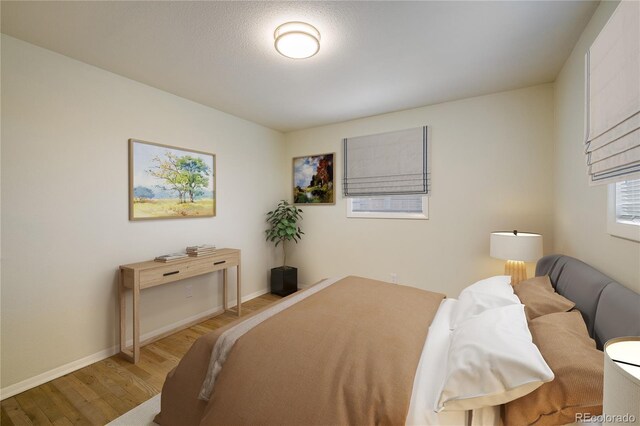 740 Lotus Way, Broomfield, CO 80020 - bedroom featuring light wood finished floors and baseboards