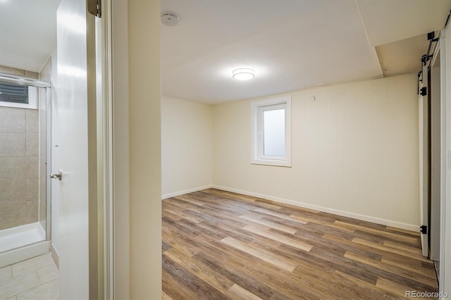 740 Lotus Way, Broomfield, CO 80020 - below grade area featuring wood finished floors and baseboards