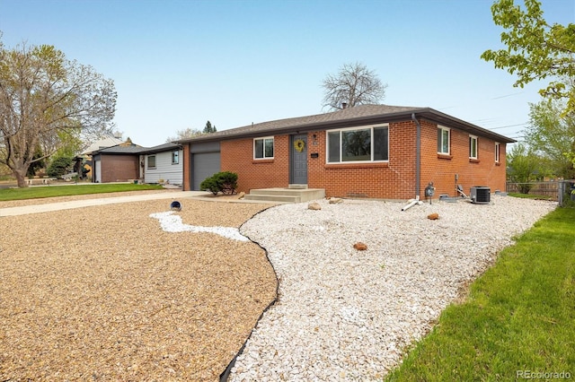 740 Lotus Way, Broomfield, CO 80020 - ranch-style house with a garage, brick siding, central AC, concrete driveway, and fence