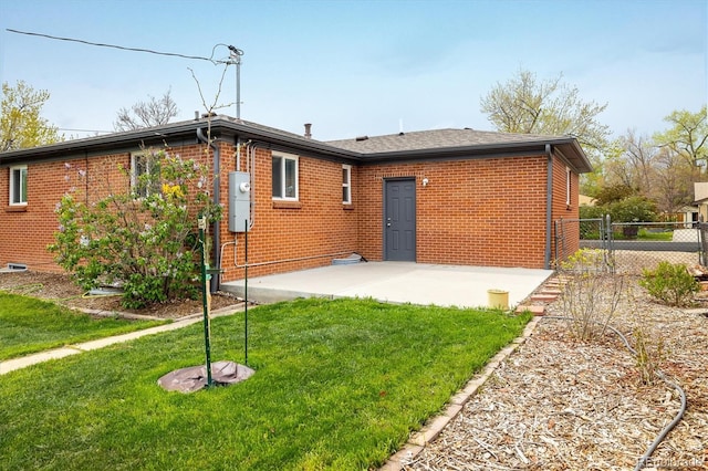 740 Lotus Way, Broomfield, CO 80020 - back of property with a patio area and brick siding