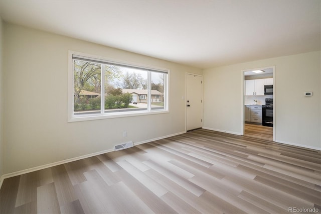 740 Lotus Way, Broomfield, CO 80020 - empty room with light wood-type flooring and baseboards
