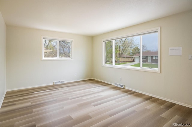 740 Lotus Way, Broomfield, CO 80020 - empty room featuring healthy amount of natural light, light wood-style flooring, and baseboards