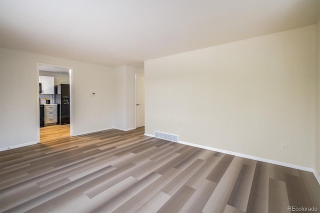 740 Lotus Way, Broomfield, CO 80020 - unfurnished room featuring wood finished floors and baseboards