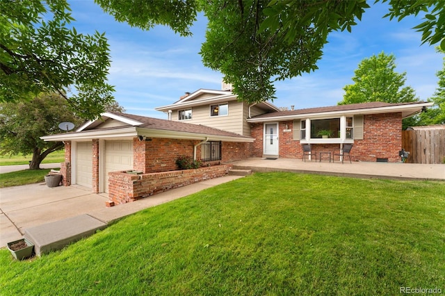 6798 Depew St, Arvada, CO 80003 - tri-level home featuring brick siding, an attached garage, concrete driveway, and a shingled roof