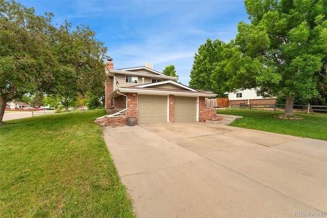6798 Depew St, Arvada, CO 80003 - view of front of home with brick siding, a chimney, concrete driveway, and a garage