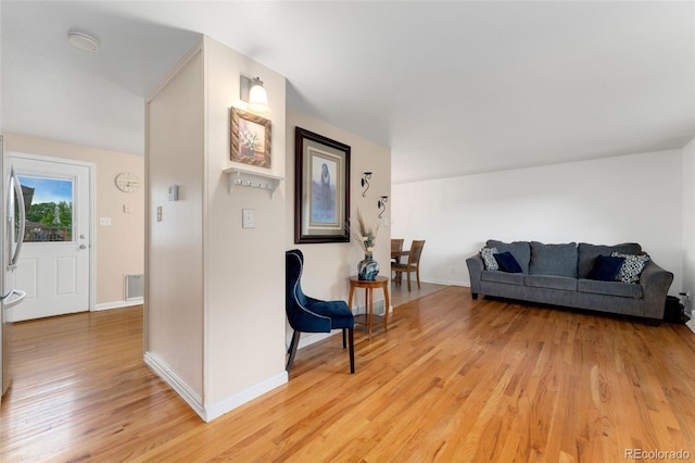 6798 Depew St, Arvada, CO 80003 - living area featuring light wood-type flooring and baseboards