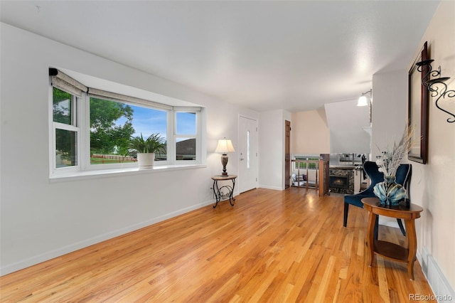 6798 Depew St, Arvada, CO 80003 - living area with light wood finished floors and baseboards
