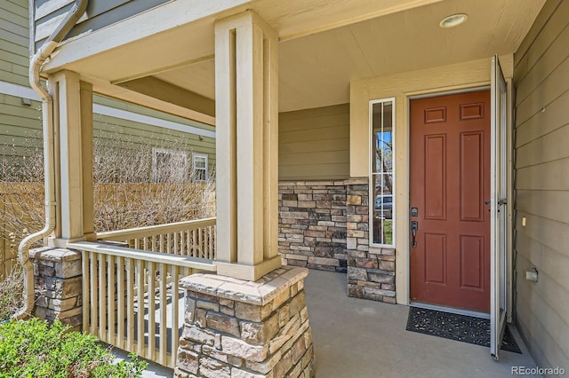 7838 W Layton Way, Littleton, CO 80123 - entrance to property featuring covered porch and stone siding