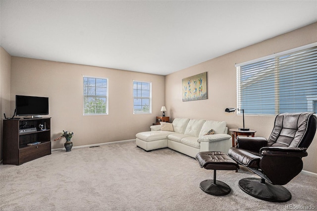 living area with carpet floors and baseboards