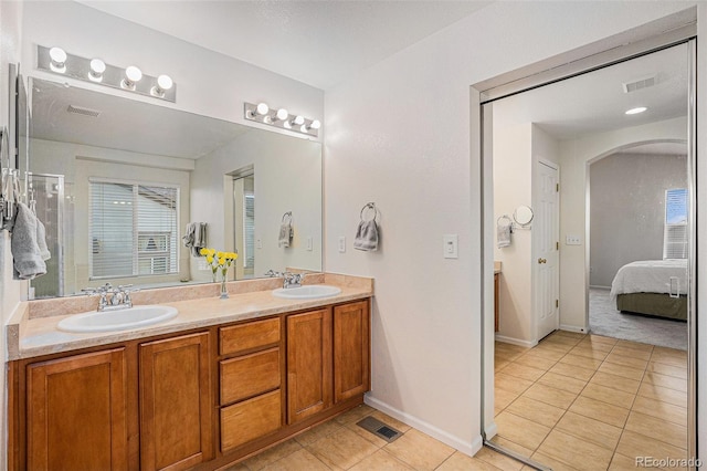 full bathroom featuring visible vents, a sink, and tile patterned flooring