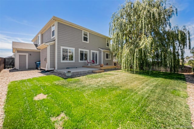 back of house featuring a patio, a fenced backyard, and a lawn
