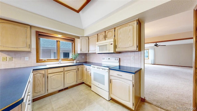 kitchen featuring white appliances, light carpet, a sink, and backsplash