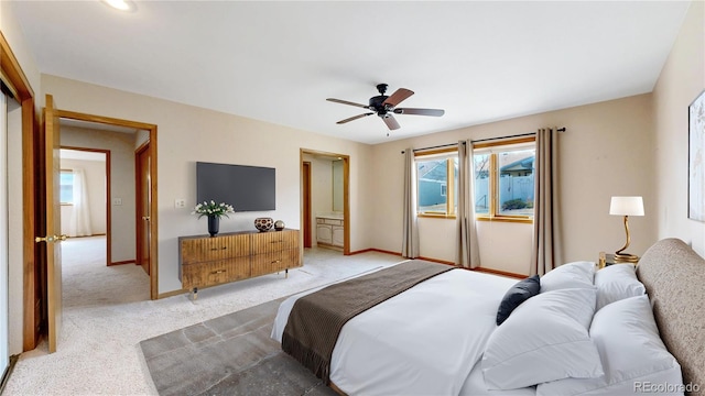 bedroom featuring light carpet, baseboards, and a ceiling fan