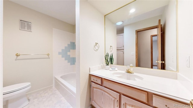 bathroom with toilet, vanity, visible vents, and baseboards