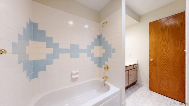 bathroom featuring tub / shower combination, vanity, and tile patterned floors