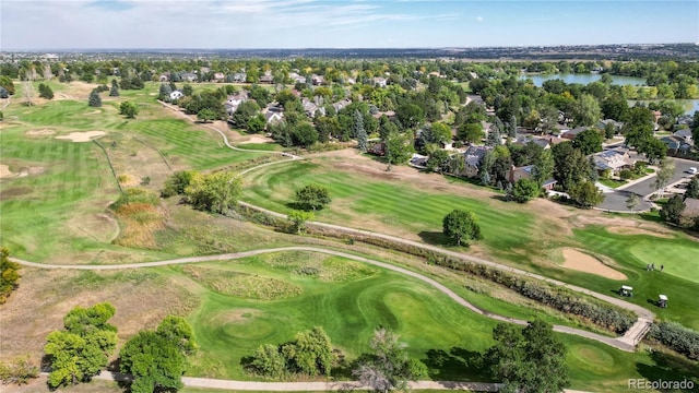 bird's eye view with view of golf course and a water view