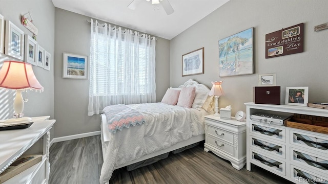 bedroom with ceiling fan and dark wood-type flooring