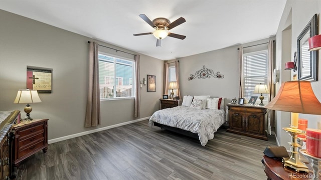 bedroom featuring ceiling fan and dark wood-type flooring