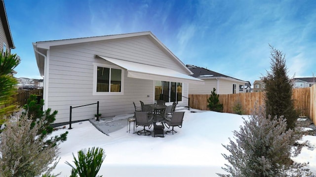 view of snow covered house