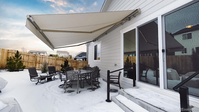 view of snow covered patio