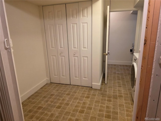 5741 W Asbury Pl, Lakewood, CO 80227 - unfurnished bedroom featuring a closet and washer / dryer