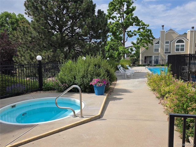 5741 W Asbury Pl, Lakewood, CO 80227 - view of swimming pool with a community hot tub