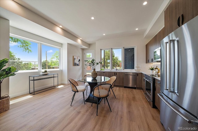1372 Lowell Blvd Unit 1, Denver, CO 80204 - dining space with plenty of natural light, light wood-style flooring, recessed lighting, and baseboards