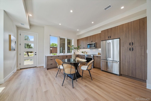 1372 Lowell Blvd Unit 1, Denver, CO 80204 - dining area with light wood-type flooring, recessed lighting, and baseboards
