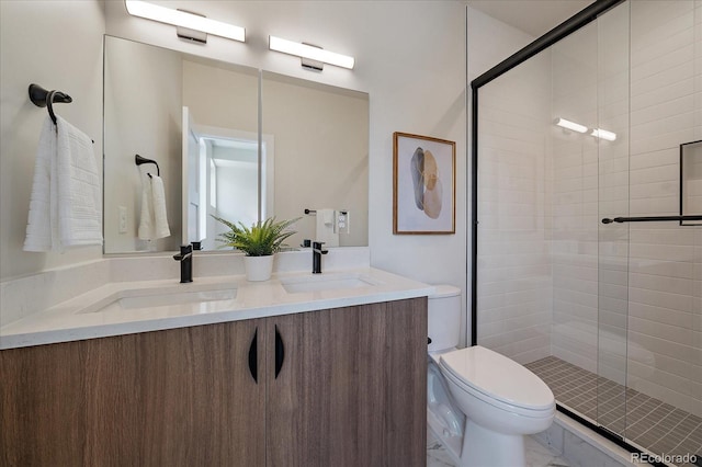 1372 Lowell Blvd Unit 1, Denver, CO 80204 - bathroom featuring double vanity, a shower stall, and toilet