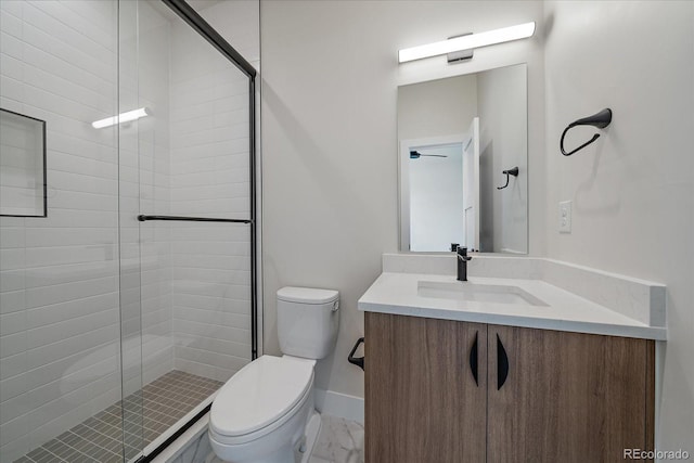 1372 Lowell Blvd Unit 1, Denver, CO 80204 - bathroom featuring toilet, vanity, a stall shower, marble finish floors, and baseboards