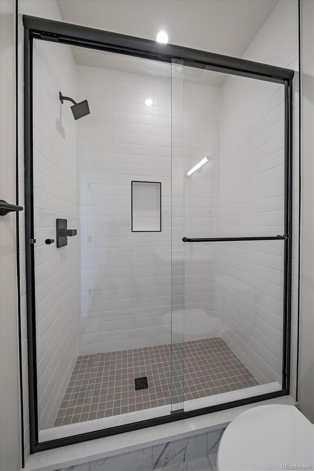 1372 Lowell Blvd Unit 1, Denver, CO 80204 - bathroom featuring a stall shower and toilet