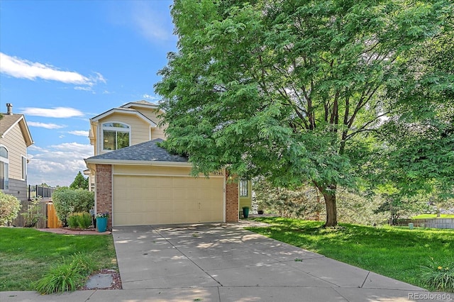 9346 W Coal Mine Ave, Littleton, CO 80123 - view of property hidden behind natural elements with brick siding, concrete driveway, a shingled roof, and a front lawn