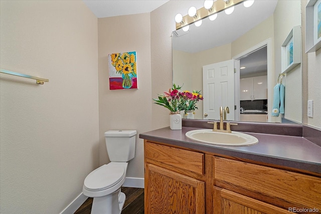 9346 W Coal Mine Ave, Littleton, CO 80123 - bathroom featuring vanity and wood finished floors