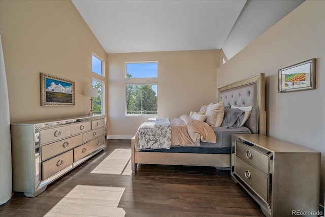9346 W Coal Mine Ave, Littleton, CO 80123 - bedroom with high vaulted ceiling and dark wood-type flooring