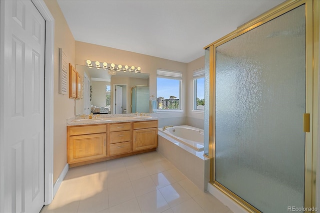9346 W Coal Mine Ave, Littleton, CO 80123 - full bath featuring a stall shower, a bath, double vanity, and tile patterned floors