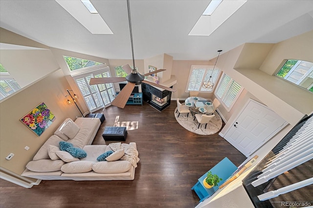 9346 W Coal Mine Ave, Littleton, CO 80123 - living area with a skylight, plenty of natural light, high vaulted ceiling, and wood finished floors