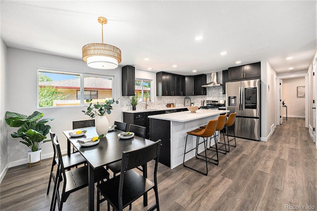 6032 Estes St, Arvada, CO 80004 - dining space with dark wood-type flooring, plenty of natural light, and recessed lighting