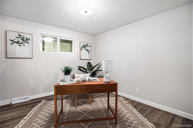 6032 Estes St, Arvada, CO 80004 - office space with dark wood-style flooring and a textured ceiling